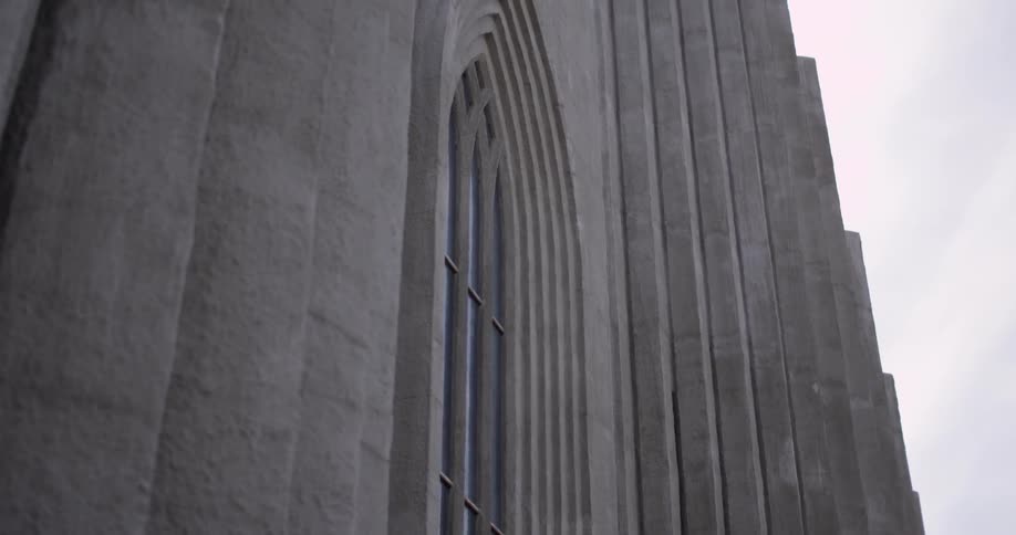 Large gray building with an arched window