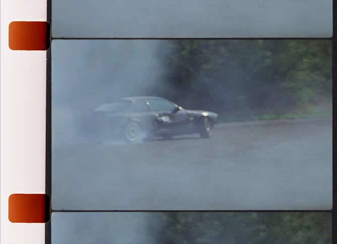 Sports cars racing on a dirt track in the countryside