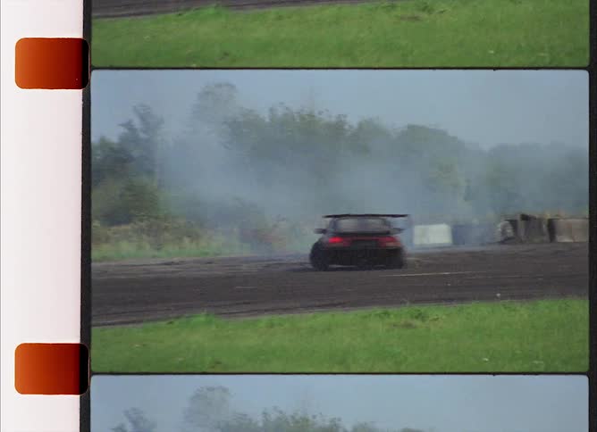 Sports car driving recklessly on a dirt track in the countryside