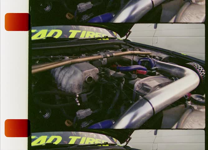 Close up of a racing car engine with its hood open