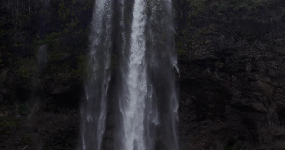 Water cascading down from a very high waterfall