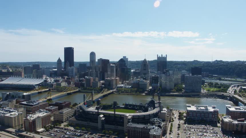 Aerial view of the skyline of a city in front of a river