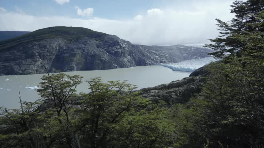 A view of a lake with mountains around it