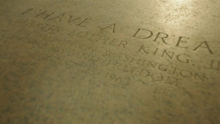 Sunlight illuminates an engraving of famous words from an american civil rights leader I Have a Dream
