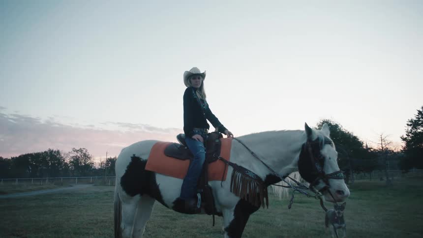 A woman sitting on a horse