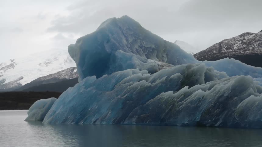 Iceberg floating on a lake in the mountains