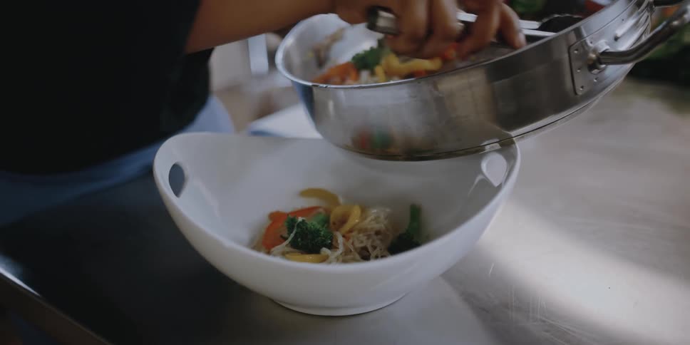 A woman serving up food