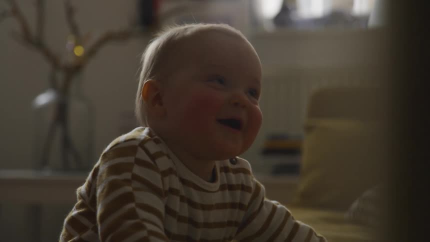 A baby in a living room