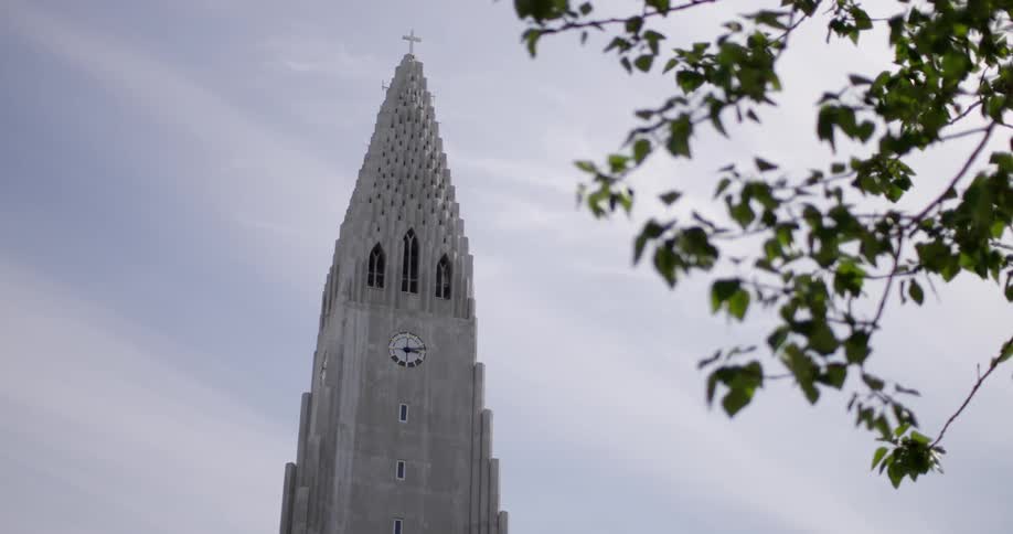 The steeple of a cathedral on an overcast day