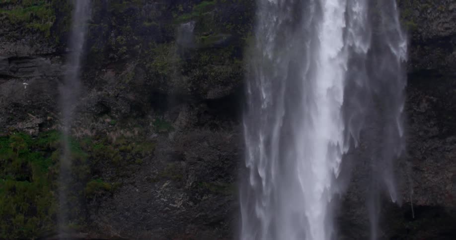 A waterfall drops water down below