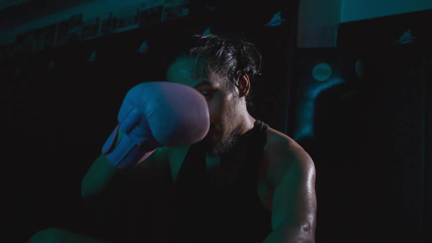 A man sitting and wiping sweataway