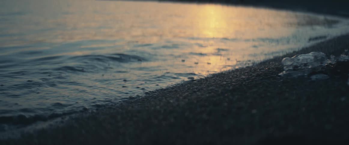 The water slowly hits the shore