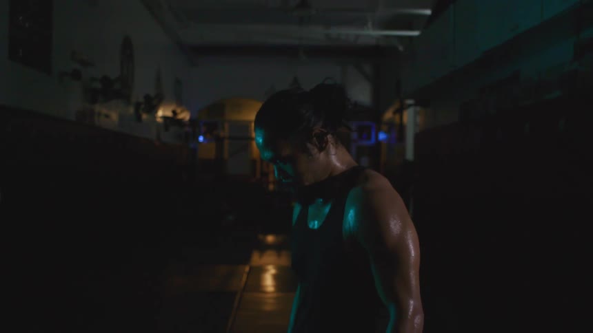 A man is working out indoors at night