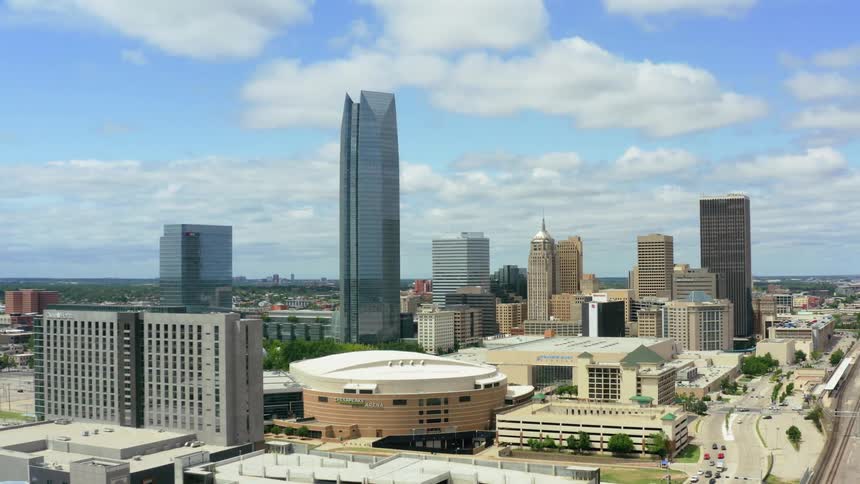 Tall skyscrapers in a city on a cloudy summer day