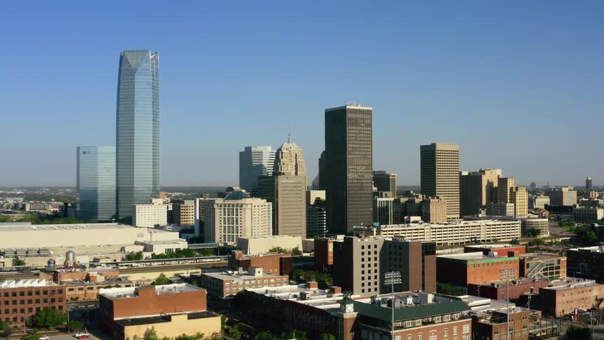 Arial shot of a city skyline with tall buildings in site