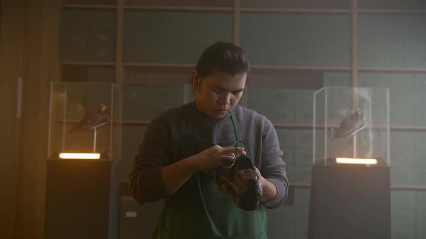 A man is washing an antique in the museum