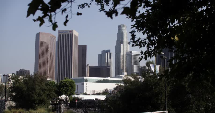 A city with tall buildings is in the distance