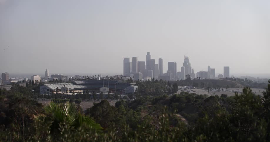 Wind blowing and a view of a distant city