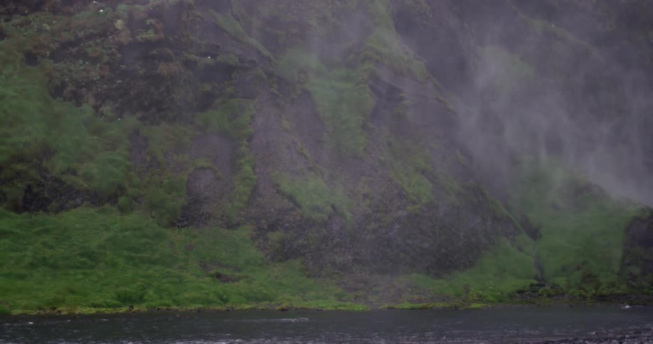 Smoke drifting across a body of water