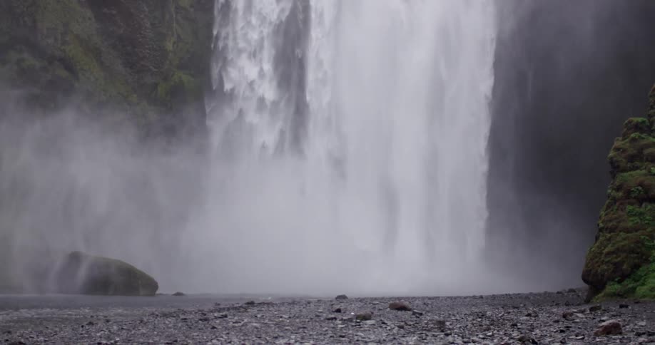 Water cascading down from a tall waterfall