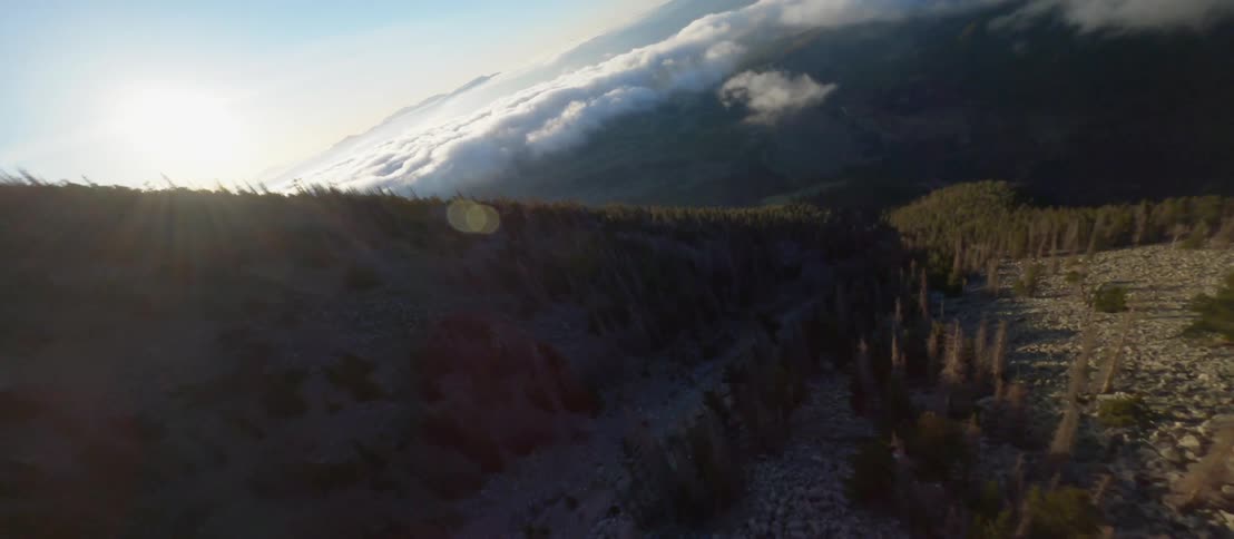 The mountain is steep and covered with stones