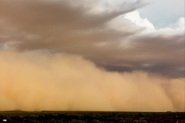 Storm front moves across forest and plains