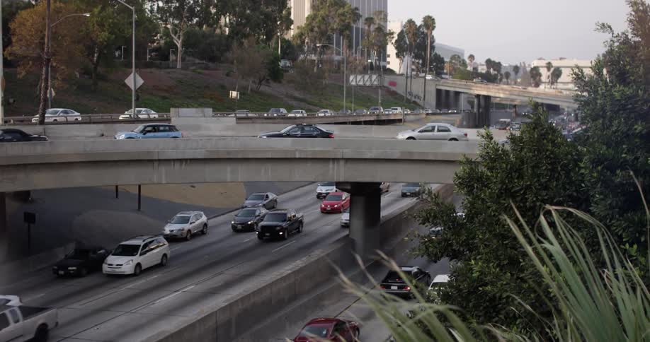 Cars driving down a busy highway