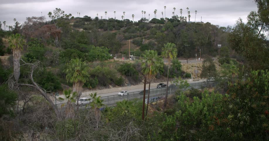 Cars are traveling on the road below