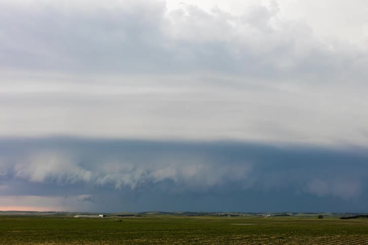 A view of a storm forming in the middle of a day