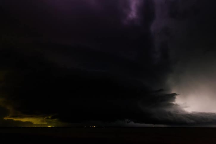A landscape with a lightning storm with the sky and clouds in the background