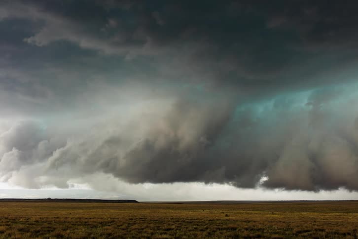 Storm clouds gathering over a field in the countryside
