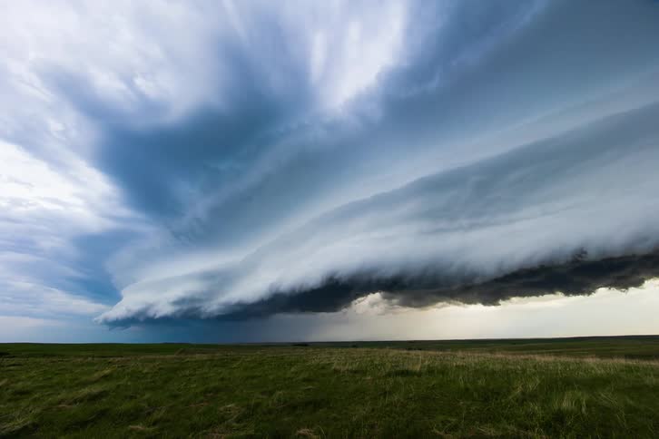 A time lapse of a storm forming over a field