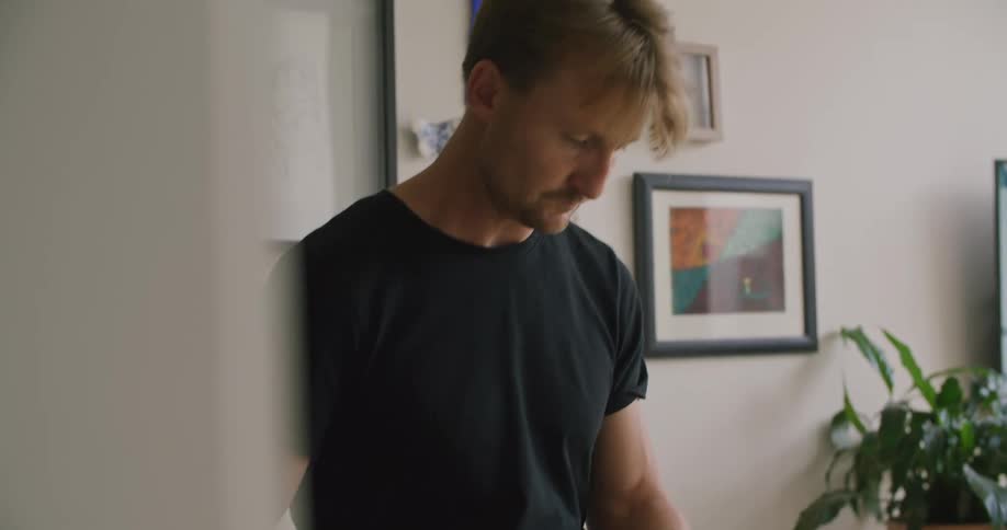 Man preparing a salad on the kitchen at home