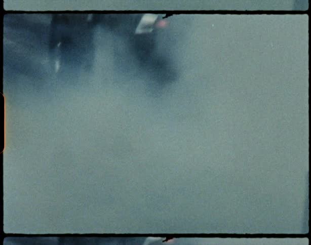 Smoke coming off tires as a car races