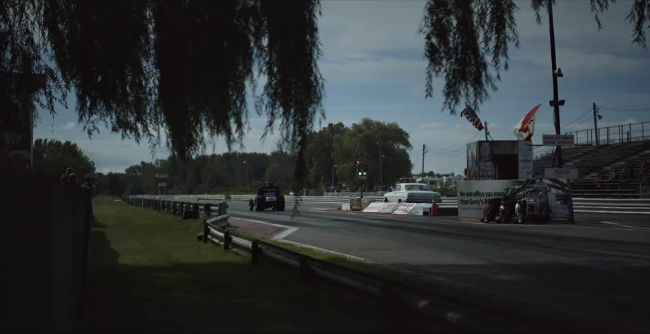 Two race cars leave the starting line