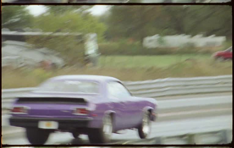 Cars racing on a drag strip