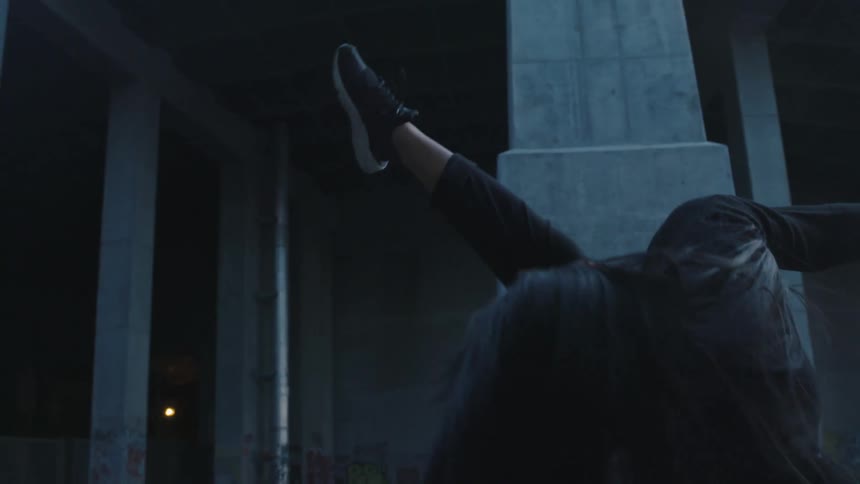 A woman dancing outdoors