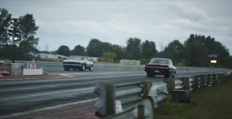 Sports car start race speeding down track as lights signal go