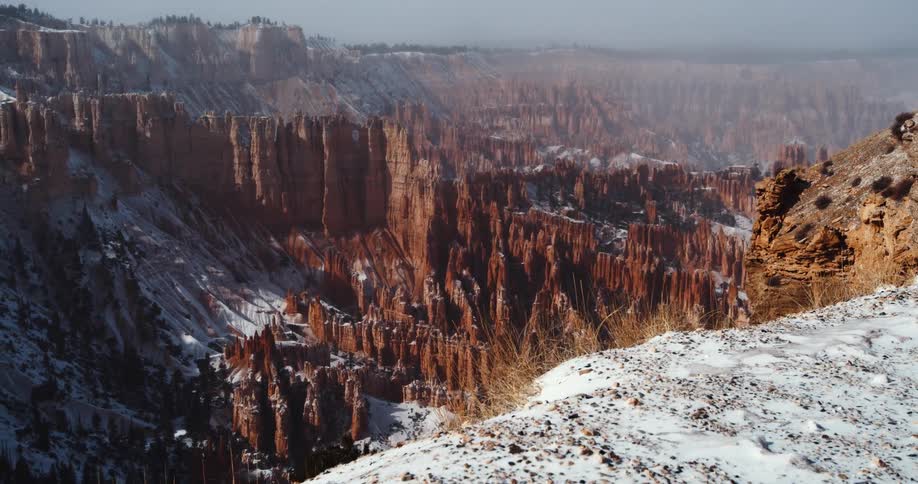 A view of a canyon on a snowy day