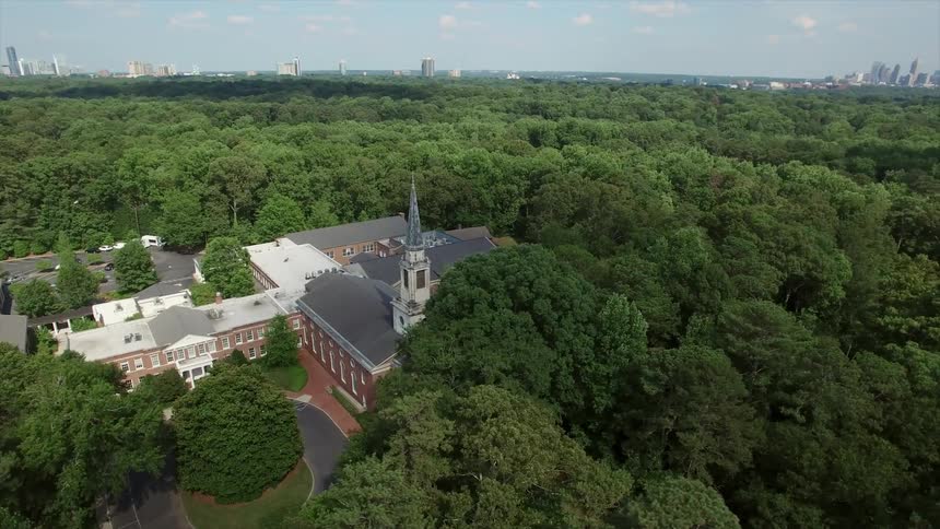 Aerial view of a large campus in the woods
