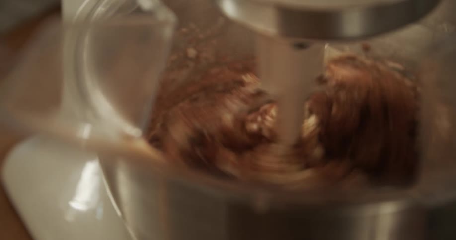 A mixer that is stirring chocolate