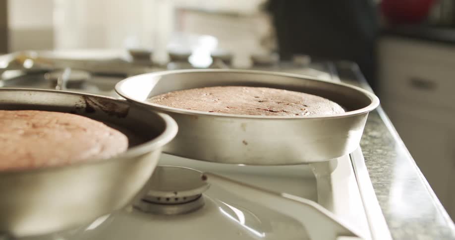 A view of two cakes sitting on a counter
