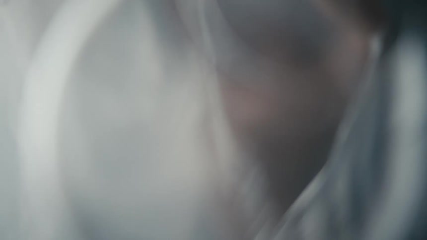 A person is struggling inside of a plastic sheet