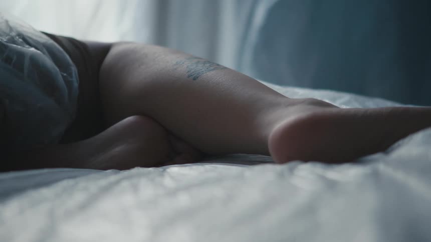 A person is laying in the bed