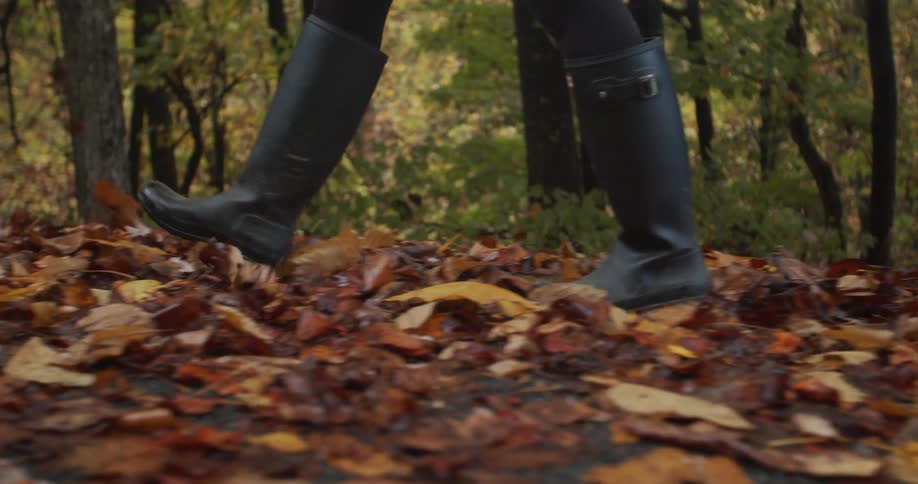 A woman is hiking in the woods