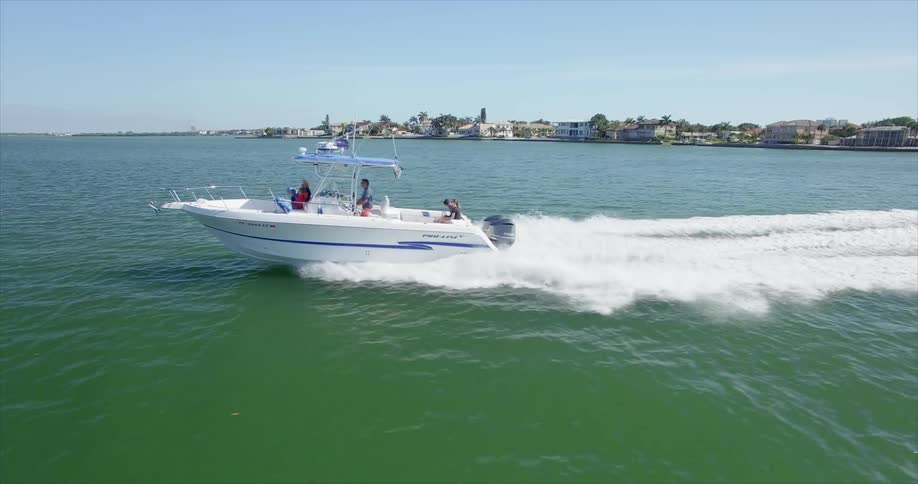 A boat is moving fast across the water