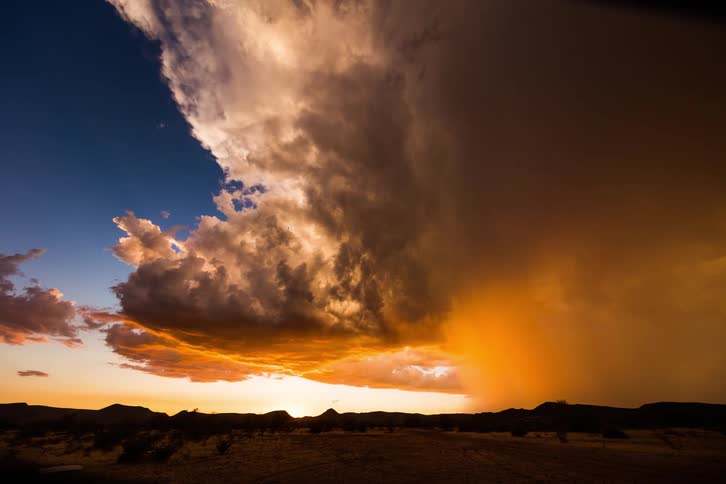 A time lapse of a storm rolling over a landscape