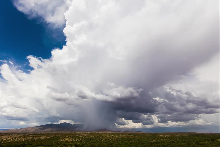Clouds are forming into a storm in a rural area