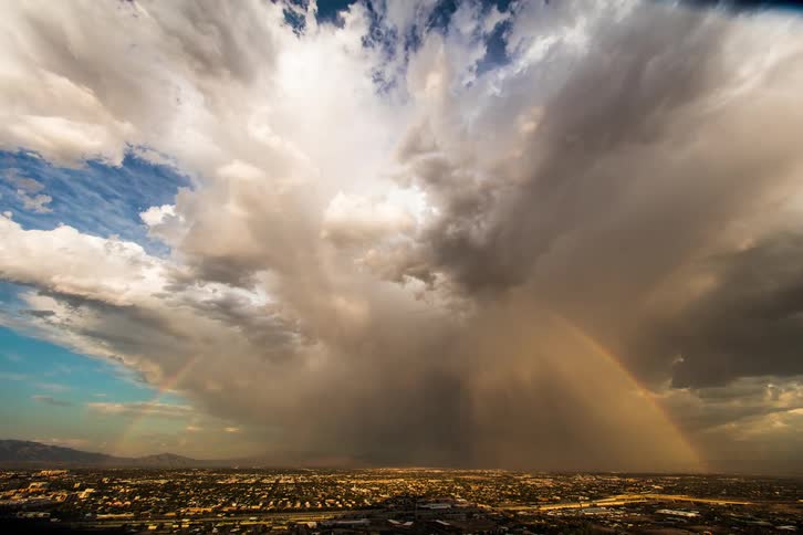 A time lapse of a storm rolling over a city