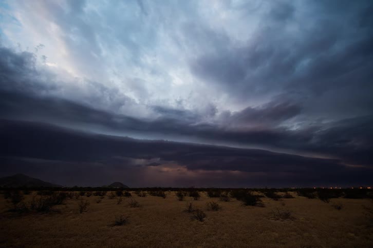 A view of a storm forming over a field